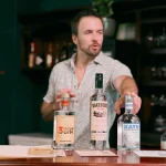 man pointing to local belize rum in cocktail class