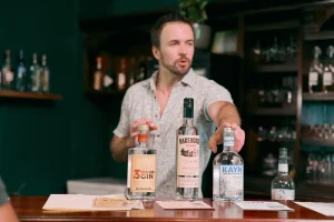 man pointing to local belize rum in cocktail class