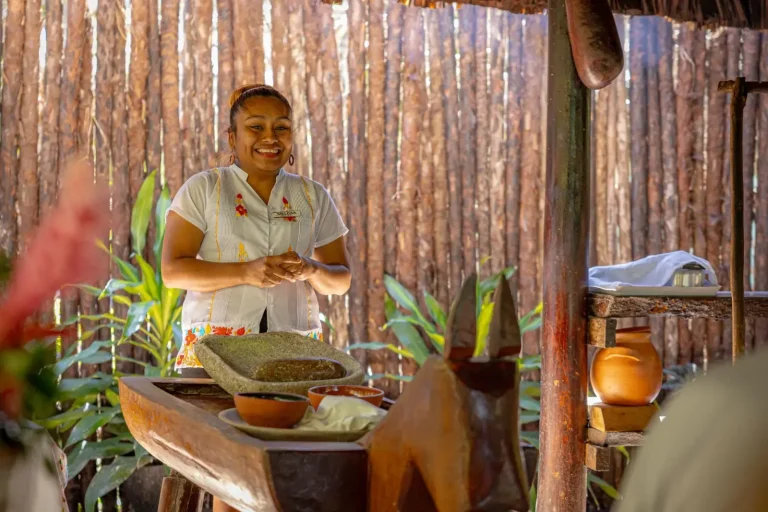 smiling mayan woman in outdoor kitchen