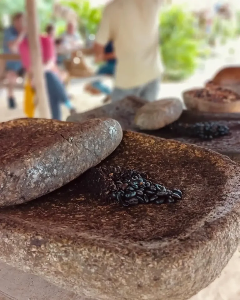 coffee beans on traditional rock grinder