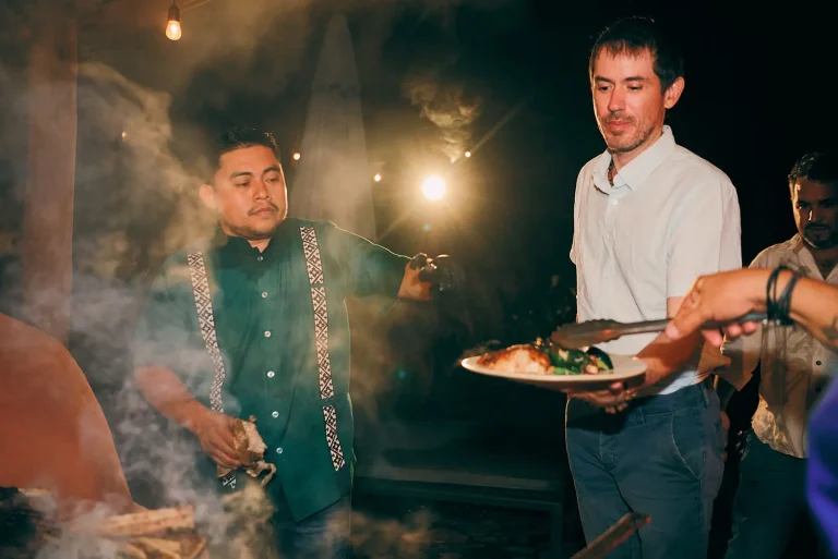 chef giving local belize dish to guest