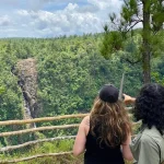 two persons overlooking 1000ft falls belize