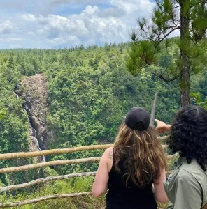 two persons overlooking 1000ft falls belize