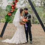married couple with jungle backdrop