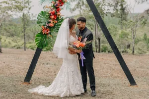 married couple with jungle backdrop
